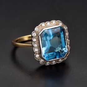 18ct Yellow Gold Emerald Cut Blue Topaz & Diamond Halo Ring