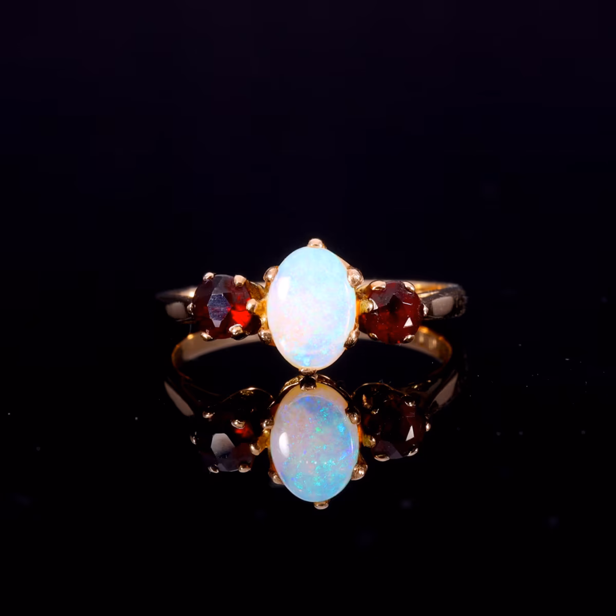 360° view of The Vintage 1982 Opal And Garnet 3 Stone Ring