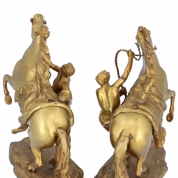 A Par Of French Gilt Metal Marly Horses