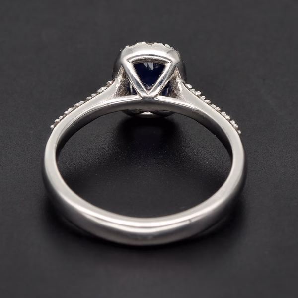18ct White Gold Oval Sapphire & Diamond Halo Ring