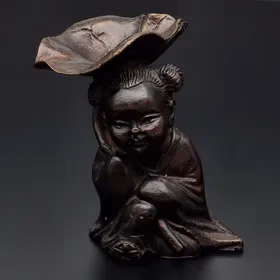 Bronze Figurine With Lotus Leaf