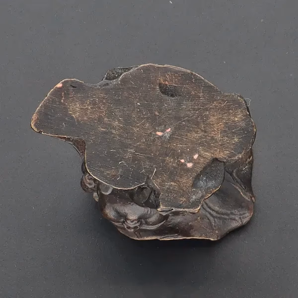 Bronze Figurine With Lotus Leaf