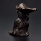 Bronze Figurine With Lotus Leaf
