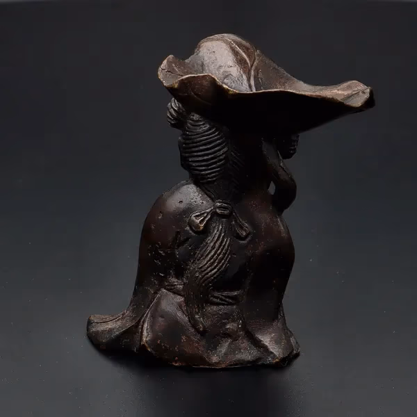 Bronze Figurine With Lotus Leaf