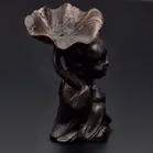 Bronze Figurine With Lotus Leaf