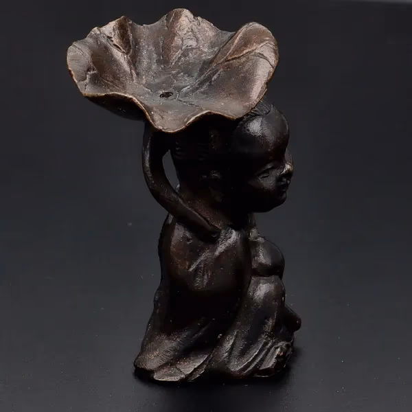 Bronze Figurine With Lotus Leaf